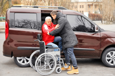 Man Helping Handicapped Person