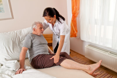 Caregiver Assisting a Senior Man