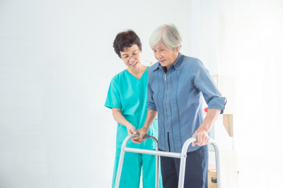 Nurse Assisting Senior Woman